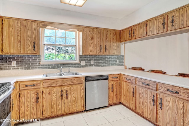 1081 Sunswept Rd NE, Palm Bay, FL 32905 - kitchen featuring appliances with stainless steel finishes, light countertops, decorative backsplash, light tile patterned flooring, and brown cabinetry