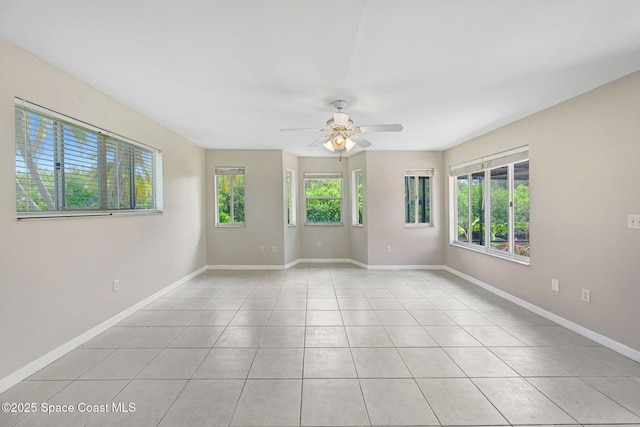 1081 Sunswept Rd NE, Palm Bay, FL 32905 - empty room with a ceiling fan and light tile patterned floors