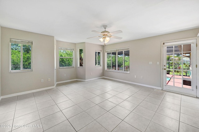 1081 Sunswept Rd NE, Palm Bay, FL 32905 - empty room with light tile patterned flooring and a ceiling fan