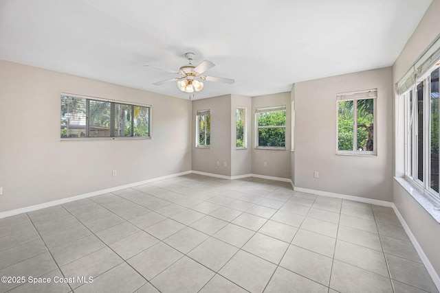 1081 Sunswept Rd NE, Palm Bay, FL 32905 - spare room featuring plenty of natural light, a ceiling fan, and light tile patterned flooring