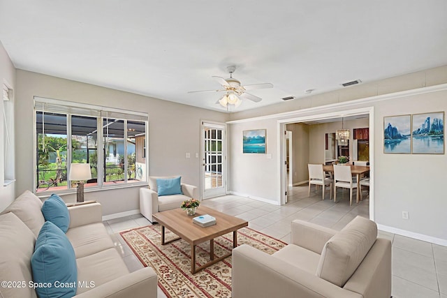 1081 Sunswept Rd NE, Palm Bay, FL 32905 - living area with a ceiling fan and light tile patterned flooring