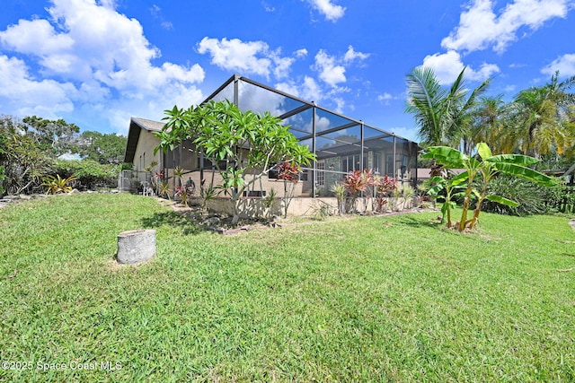 1081 Sunswept Rd NE, Palm Bay, FL 32905 - view of green lawn featuring glass enclosure