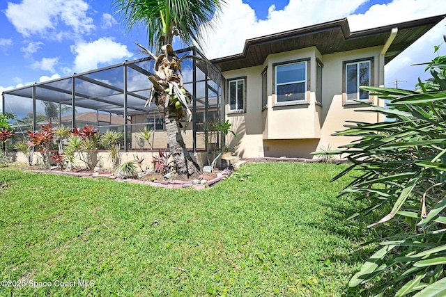 1081 Sunswept Rd NE, Palm Bay, FL 32905 - view of green lawn with glass enclosure