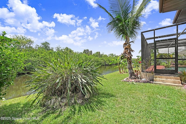 1081 Sunswept Rd NE, Palm Bay, FL 32905 - view of green lawn featuring a lanai and a swimming pool