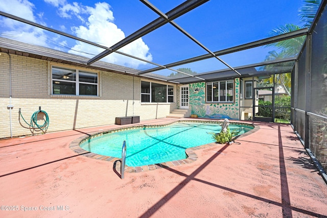 1081 Sunswept Rd NE, Palm Bay, FL 32905 - outdoor pool featuring a patio area, entry steps, and glass enclosure