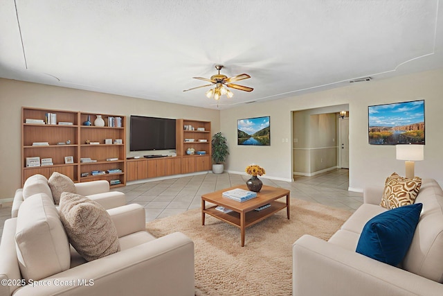 1081 Sunswept Rd NE, Palm Bay, FL 32905 - living room with light tile patterned flooring and ceiling fan