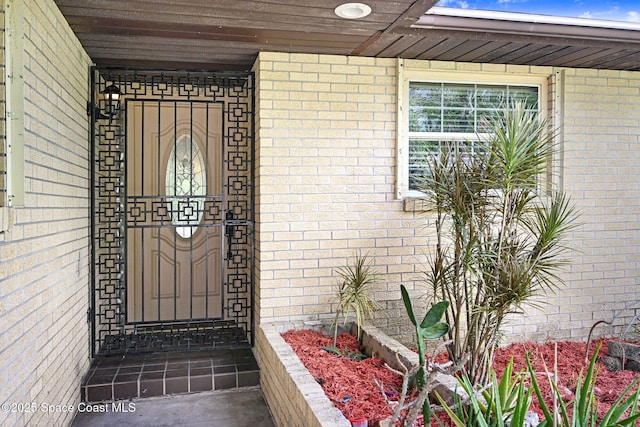 1081 Sunswept Rd NE, Palm Bay, FL 32905 - doorway to property with brick siding