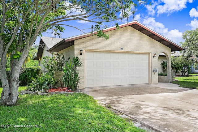1081 Sunswept Rd NE, Palm Bay, FL 32905 - view of front facade featuring brick siding, driveway, an attached garage, and a front yard