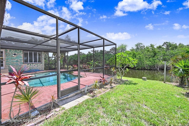 1081 Sunswept Rd NE, Palm Bay, FL 32905 - swimming pool featuring a lawn, a patio, and a water view