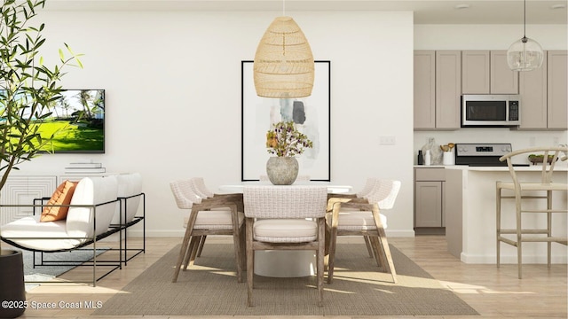 2643 Antarus Dr NW, Palm Bay, FL 32907 - dining space featuring light wood-style floors and baseboards