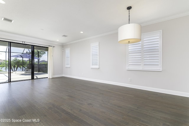 3975 Archdale St, Melbourne, FL 32940 - spare room featuring crown molding, dark wood finished floors, and recessed lighting