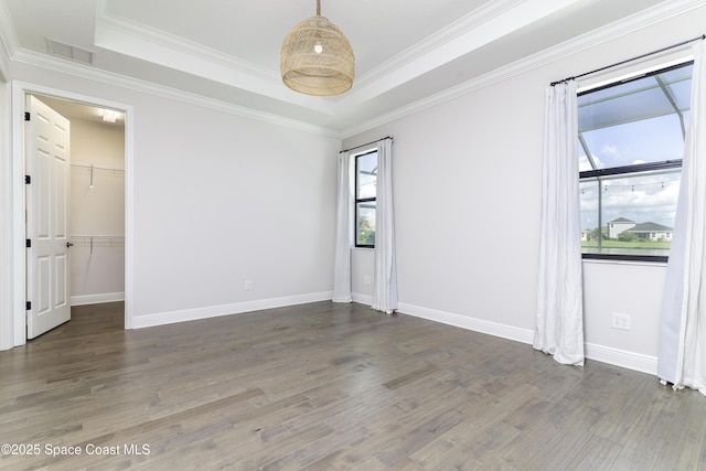3975 Archdale St, Melbourne, FL 32940 - unfurnished room featuring wood finished floors, a raised ceiling, and ornamental molding