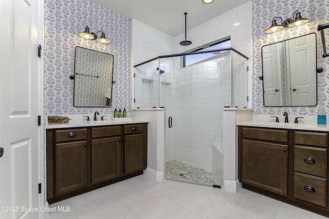 3975 Archdale St, Melbourne, FL 32940 - bathroom with a shower stall, two vanities, and tile patterned flooring