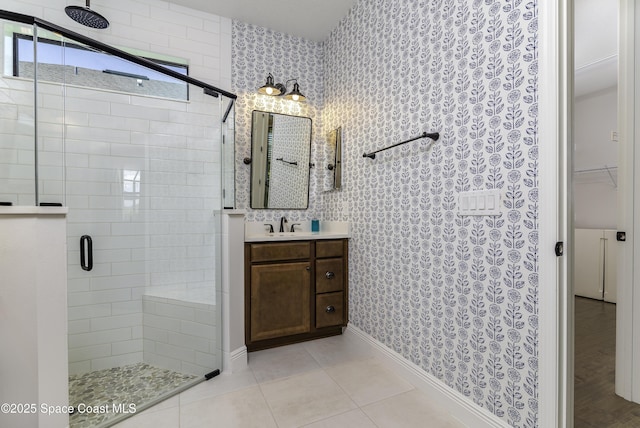 3975 Archdale St, Melbourne, FL 32940 - bathroom featuring a stall shower, vanity, wallpapered walls, a spacious closet, and tile patterned floors