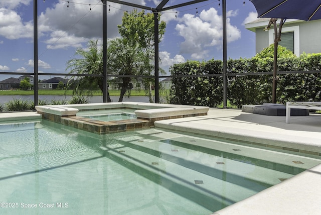 3975 Archdale St, Melbourne, FL 32940 - view of pool featuring a pool with connected hot tub, glass enclosure, and a patio