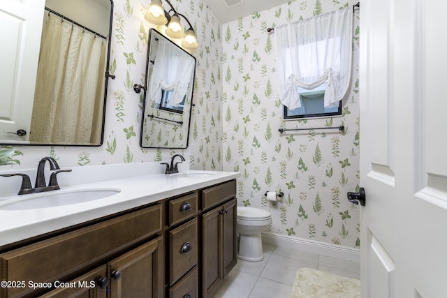 3975 Archdale St, Melbourne, FL 32940 - full bathroom featuring wallpapered walls, double vanity, and tile patterned floors