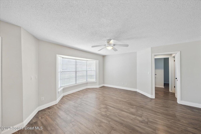 1871 Talloak Rd, Melbourne, FL 32935 - unfurnished room with wood finished floors, a ceiling fan, and a textured ceiling
