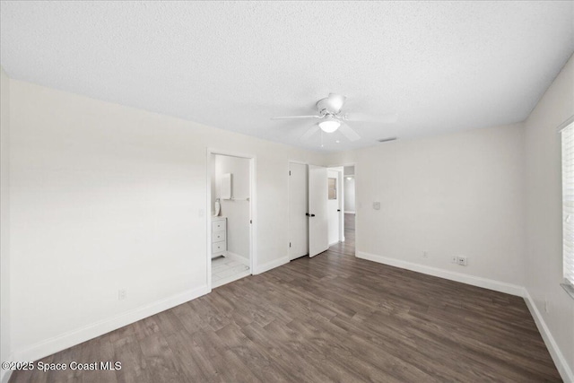 1871 Talloak Rd, Melbourne, FL 32935 - unfurnished bedroom with wood finished floors, a textured ceiling, ensuite bath, and a ceiling fan