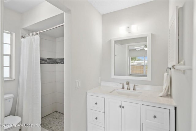 1871 Talloak Rd, Melbourne, FL 32935 - bathroom with ceiling fan, vanity, and a tile shower