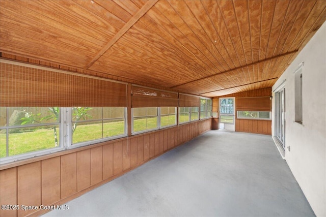 1871 Talloak Rd, Melbourne, FL 32935 - unfurnished sunroom featuring wood ceiling, concrete flooring, and wooden walls