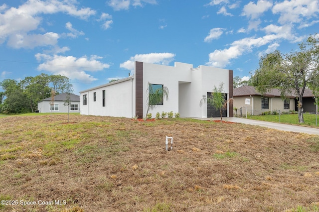 1889 Warton Ave SE, Palm Bay, FL 32909 - contemporary house with stucco siding and driveway