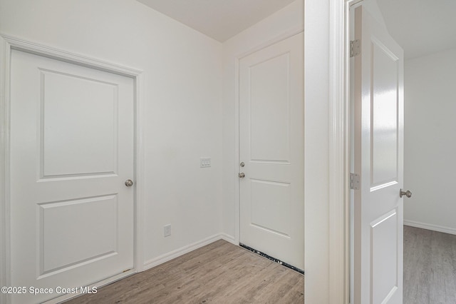 1889 Warton Ave SE, Palm Bay, FL 32909 - hallway featuring light wood-style floors and baseboards
