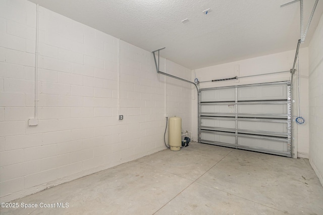 1889 Warton Ave SE, Palm Bay, FL 32909 - garage featuring concrete block wall