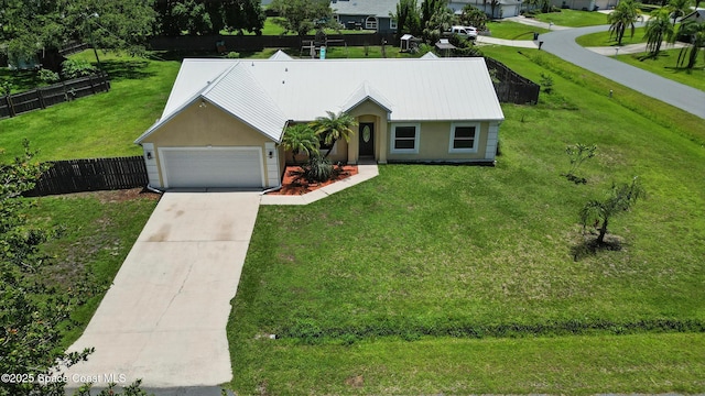 2749 Digby Rd SE, Palm Bay, FL 32909 - ranch-style home with driveway, a garage, stucco siding, and a metal roof