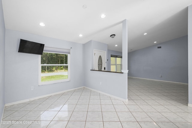 2749 Digby Rd SE, Palm Bay, FL 32909 - unfurnished room with recessed lighting, vaulted ceiling, and light tile patterned floors