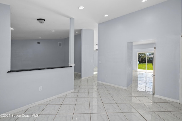 2749 Digby Rd SE, Palm Bay, FL 32909 - spare room with recessed lighting and light tile patterned floors