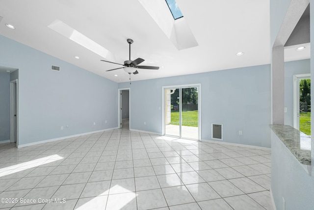 2749 Digby Rd SE, Palm Bay, FL 32909 - empty room with a skylight, vaulted ceiling, a ceiling fan, recessed lighting, and light tile patterned flooring