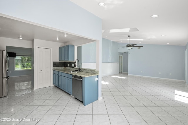 2749 Digby Rd SE, Palm Bay, FL 32909 - kitchen featuring stainless steel appliances, a skylight, ceiling fan, recessed lighting, and light stone counters