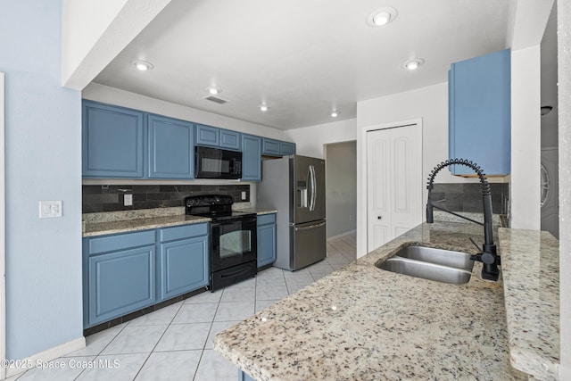 2749 Digby Rd SE, Palm Bay, FL 32909 - kitchen featuring black appliances, blue cabinets, light stone countertops, decorative backsplash, and recessed lighting