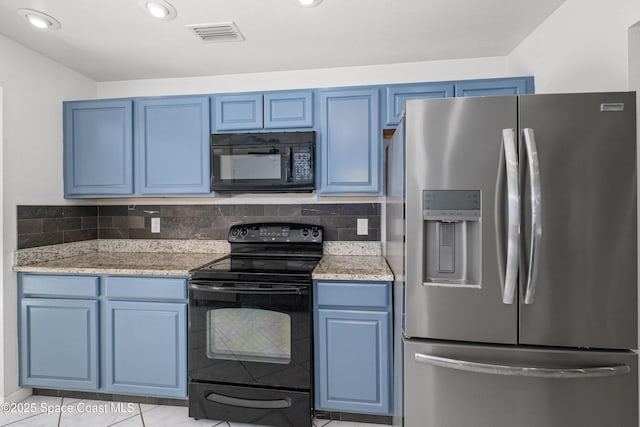 2749 Digby Rd SE, Palm Bay, FL 32909 - kitchen featuring black appliances, blue cabinets, light tile patterned floors, light stone countertops, and recessed lighting