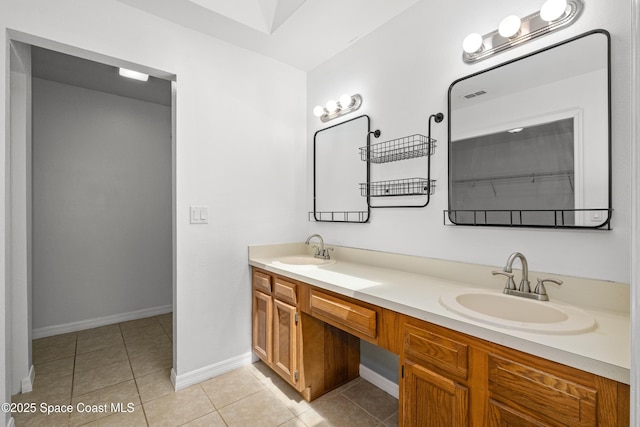 2749 Digby Rd SE, Palm Bay, FL 32909 - bathroom with double vanity and tile patterned flooring
