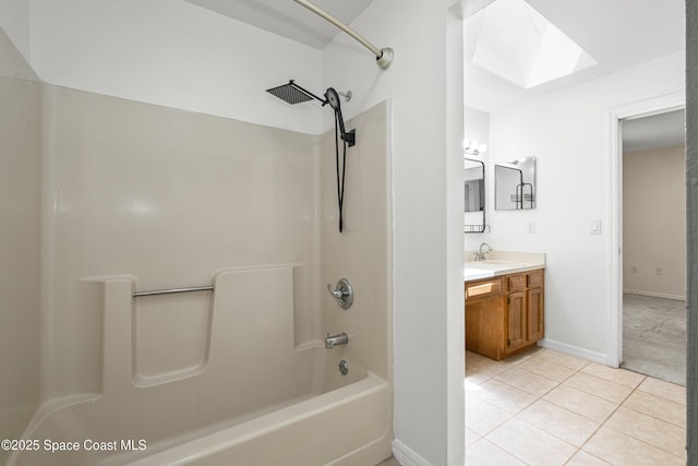 2749 Digby Rd SE, Palm Bay, FL 32909 - full bath with shower / washtub combination, vanity, tile patterned flooring, and a skylight