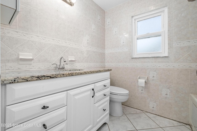 2749 Digby Rd SE, Palm Bay, FL 32909 - bathroom with vanity, tile walls, and tile patterned floors