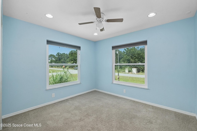 2749 Digby Rd SE, Palm Bay, FL 32909 - carpeted empty room featuring healthy amount of natural light, recessed lighting, and ceiling fan