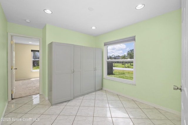 2749 Digby Rd SE, Palm Bay, FL 32909 - unfurnished bedroom with light tile patterned flooring, recessed lighting, and a closet