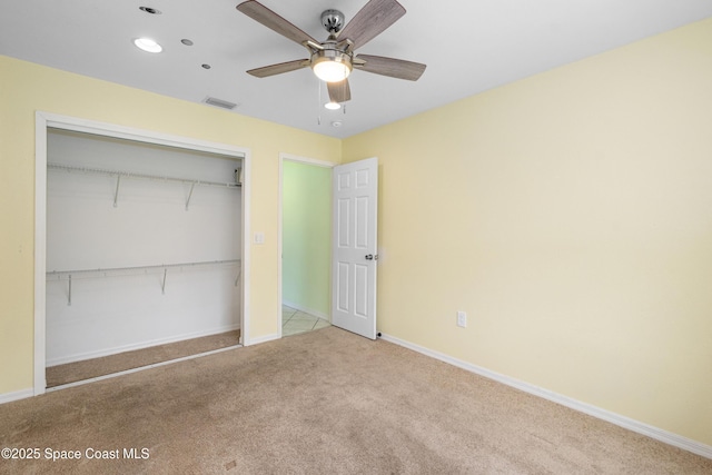 2749 Digby Rd SE, Palm Bay, FL 32909 - unfurnished bedroom featuring carpet, a closet, recessed lighting, and a ceiling fan