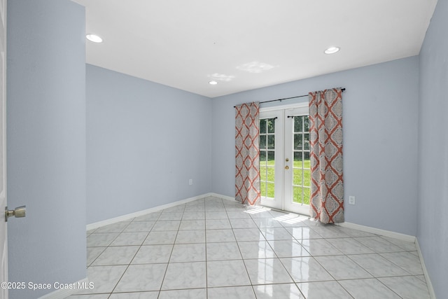 2749 Digby Rd SE, Palm Bay, FL 32909 - unfurnished room featuring french doors, recessed lighting, and light tile patterned floors