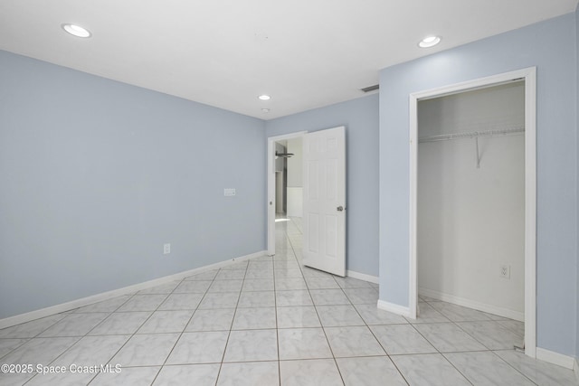 2749 Digby Rd SE, Palm Bay, FL 32909 - unfurnished bedroom with a closet, recessed lighting, and light tile patterned flooring