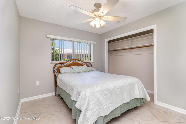714 Catalina Rd Unit 2, Cocoa Beach, FL 32931 - bedroom with light tile patterned floors, a closet, and a ceiling fan