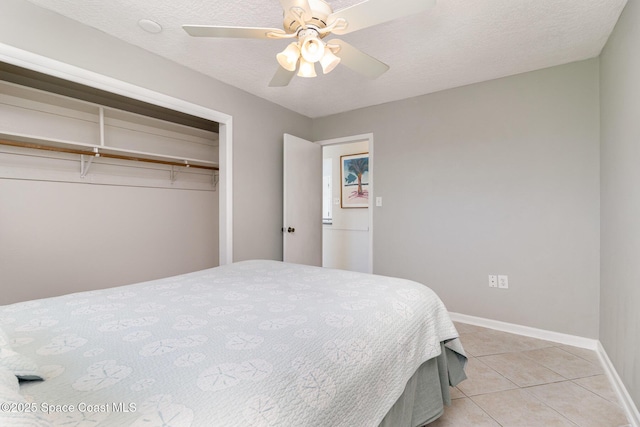 714 Catalina Rd Unit 2, Cocoa Beach, FL 32931 - bedroom featuring a closet, light tile patterned floors, and a ceiling fan
