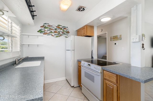 714 Catalina Rd Unit 2, Cocoa Beach, FL 32931 - kitchen with white appliances, open shelves, dark countertops, and light tile patterned flooring