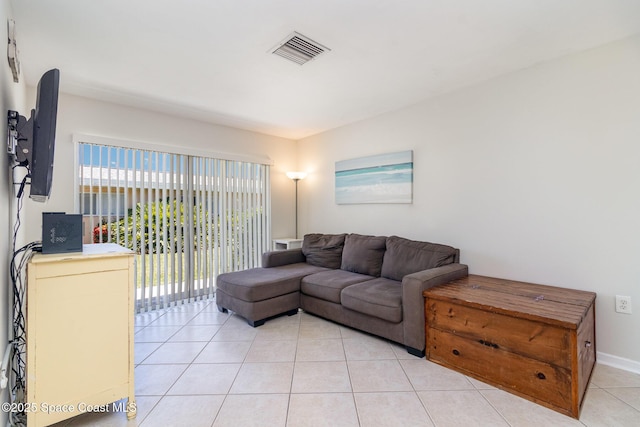 714 Catalina Rd Unit 2, Cocoa Beach, FL 32931 - living room with light tile patterned floors and baseboards