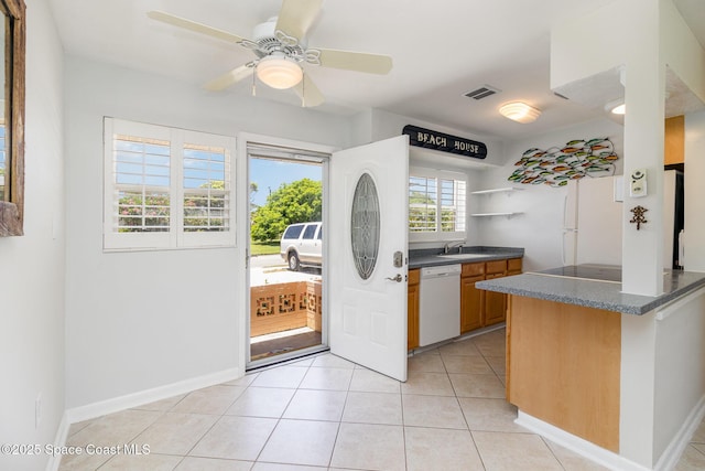 714 Catalina Rd Unit 2, Cocoa Beach, FL 32931 - kitchen with white appliances, light tile patterned floors, a ceiling fan, and open shelves