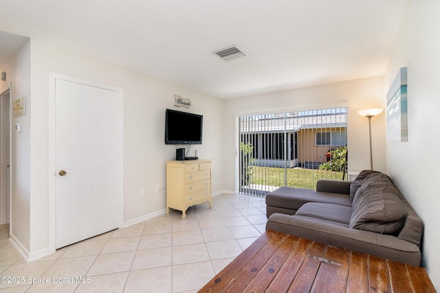 714 Catalina Rd Unit 2, Cocoa Beach, FL 32931 - living room with light tile patterned flooring and baseboards