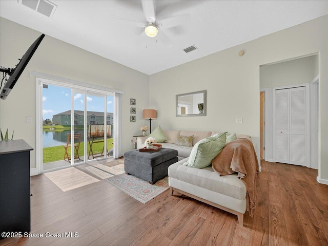4086 Meander Pl Unit 104, Rockledge, FL 32955 - living area featuring wood finished floors and a ceiling fan