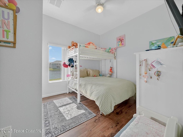 4086 Meander Pl Unit 104, Rockledge, FL 32955 - bedroom featuring wood finished floors and a ceiling fan
